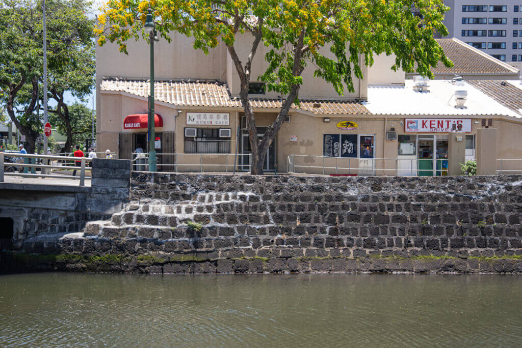 Global Specialty team performing demolition of brick pavers and sidewalk at Nuuanu Stream flood control site